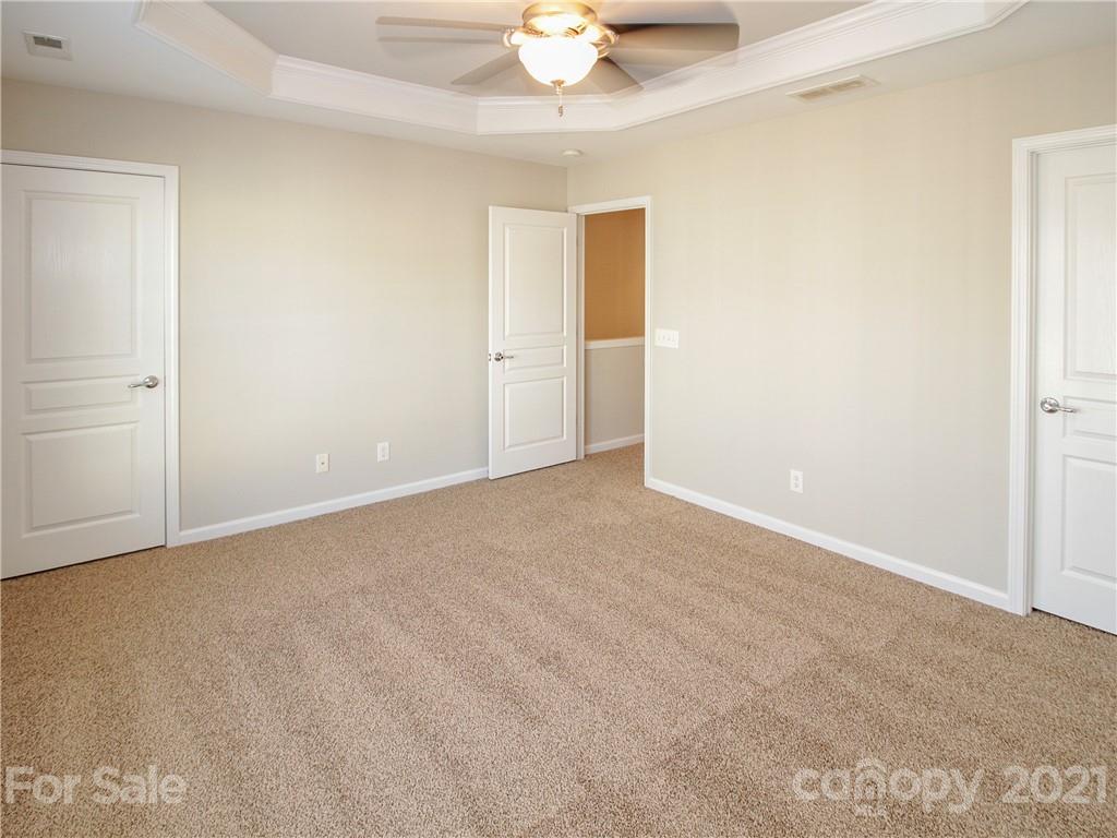 629 6th Baxter Crossing Fort Mill, SC 29708 - Photo 19 of 31 a view of an empty room with a chandelier fan