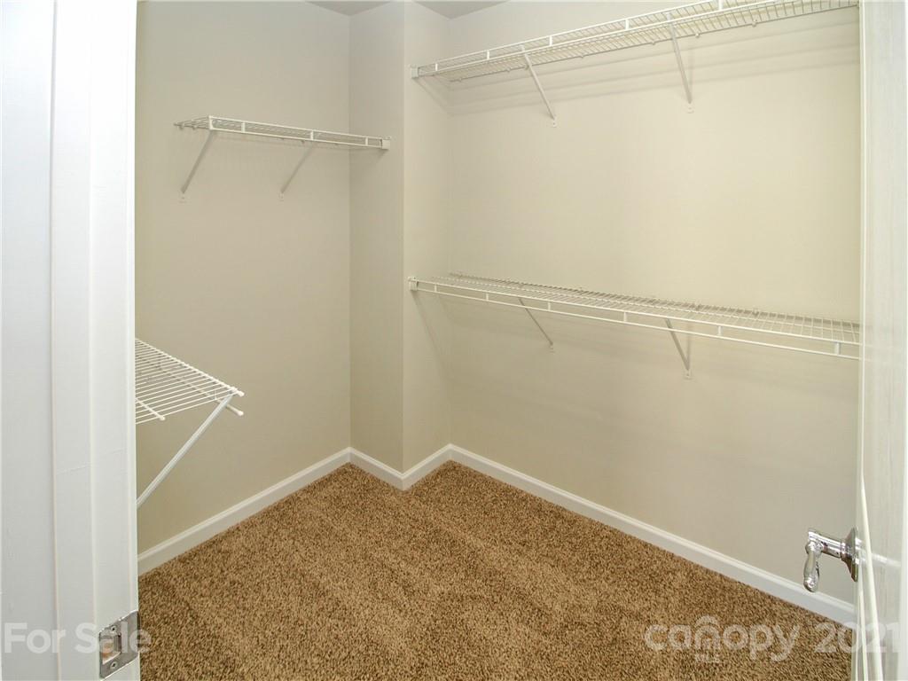 629 6th Baxter Crossing Fort Mill, SC 29708 - Photo 20 of 31 a view of a room with racks on the wall