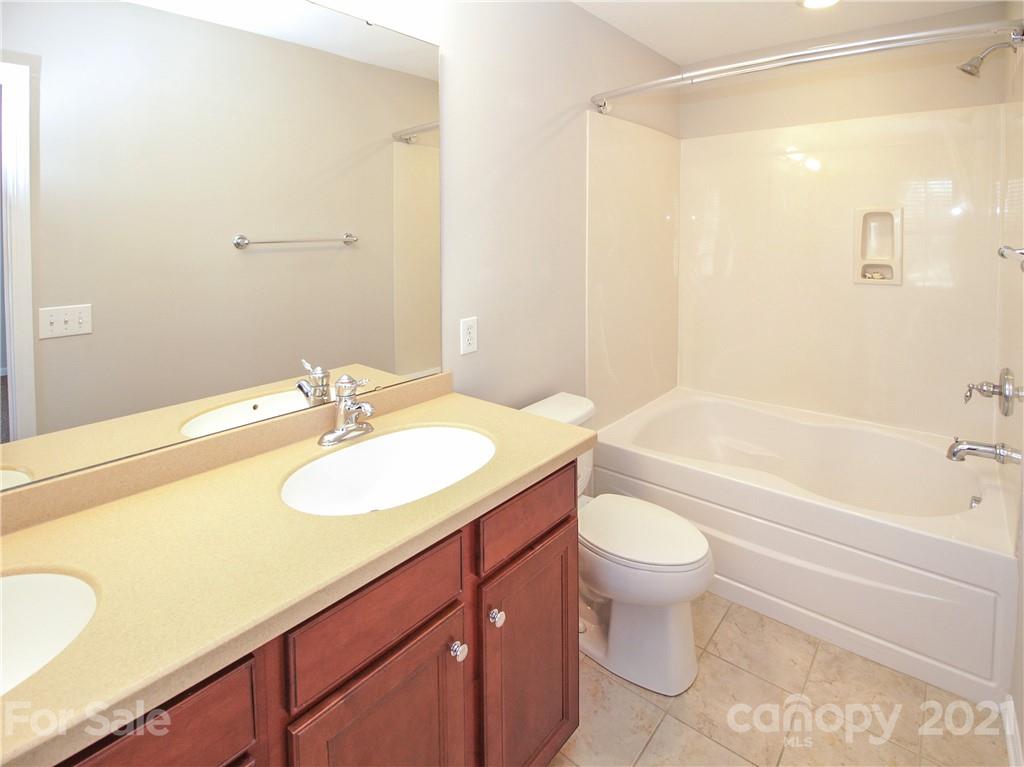 629 6th Baxter Crossing Fort Mill, SC 29708 - Photo 21 of 31 a bathroom with a sink a toilet and a bathtub