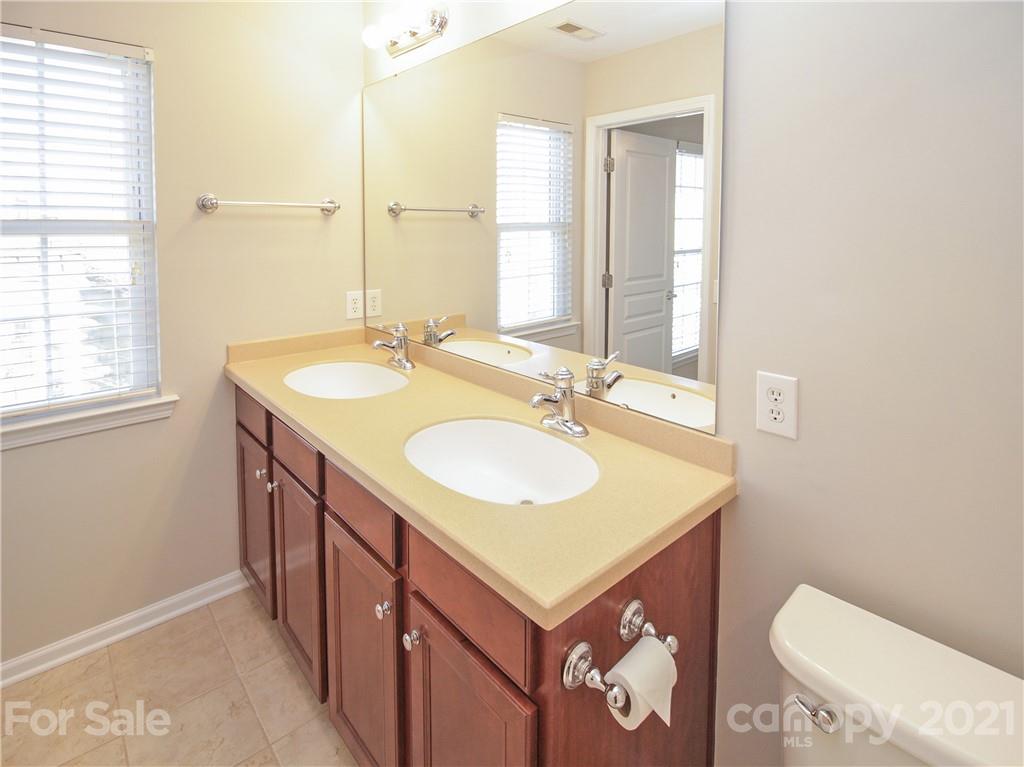 629 6th Baxter Crossing Fort Mill, SC 29708 - Photo 22 of 31 a bathroom with a sink a toilet and a mirror