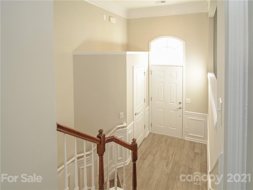 629 6th Baxter Crossing Fort Mill, SC 29708 - Photo 23 of 31 a view of a room with wooden floor and bathroom