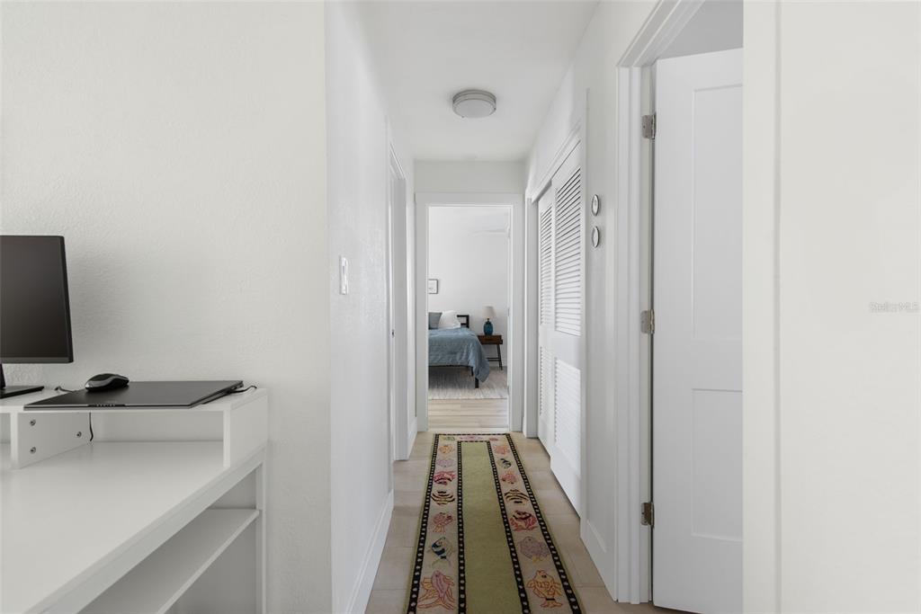 840 Park Road Englewood, FL 34223 - Photo 38 of 76 a view of a hallway with workspace and mirror