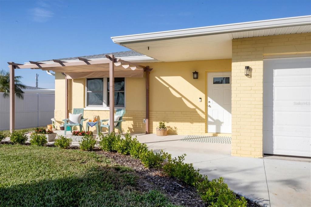 840 Park Road Englewood, FL 34223 - Photo 10 of 76 a front view of a house with a yard