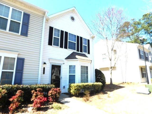 1795 Devon Drive Atlanta, GA 30311 - Photo 2 of 26 a front view of a house with a yard