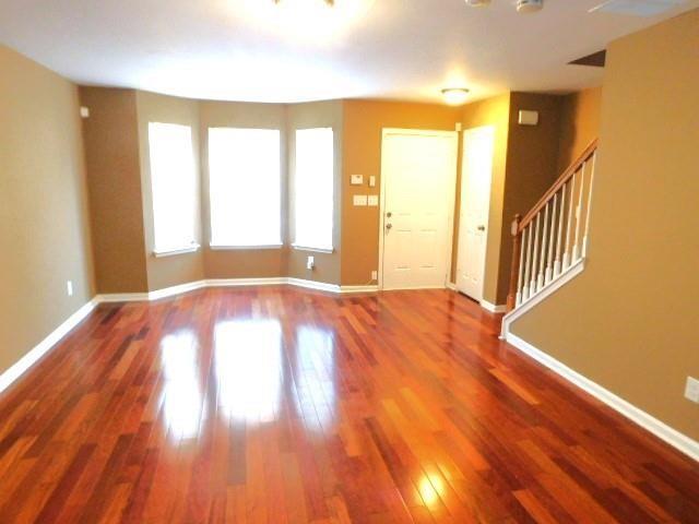 1795 Devon Drive Atlanta, GA 30311 - Photo 4 of 26 a view of an empty room with wooden floor and a window