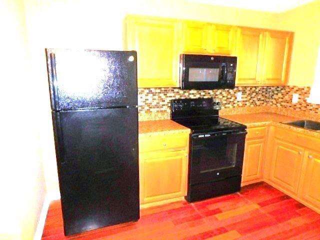 1795 Devon Drive Atlanta, GA 30311 - Photo 8 of 26 a kitchen with a sink and a refrigerator