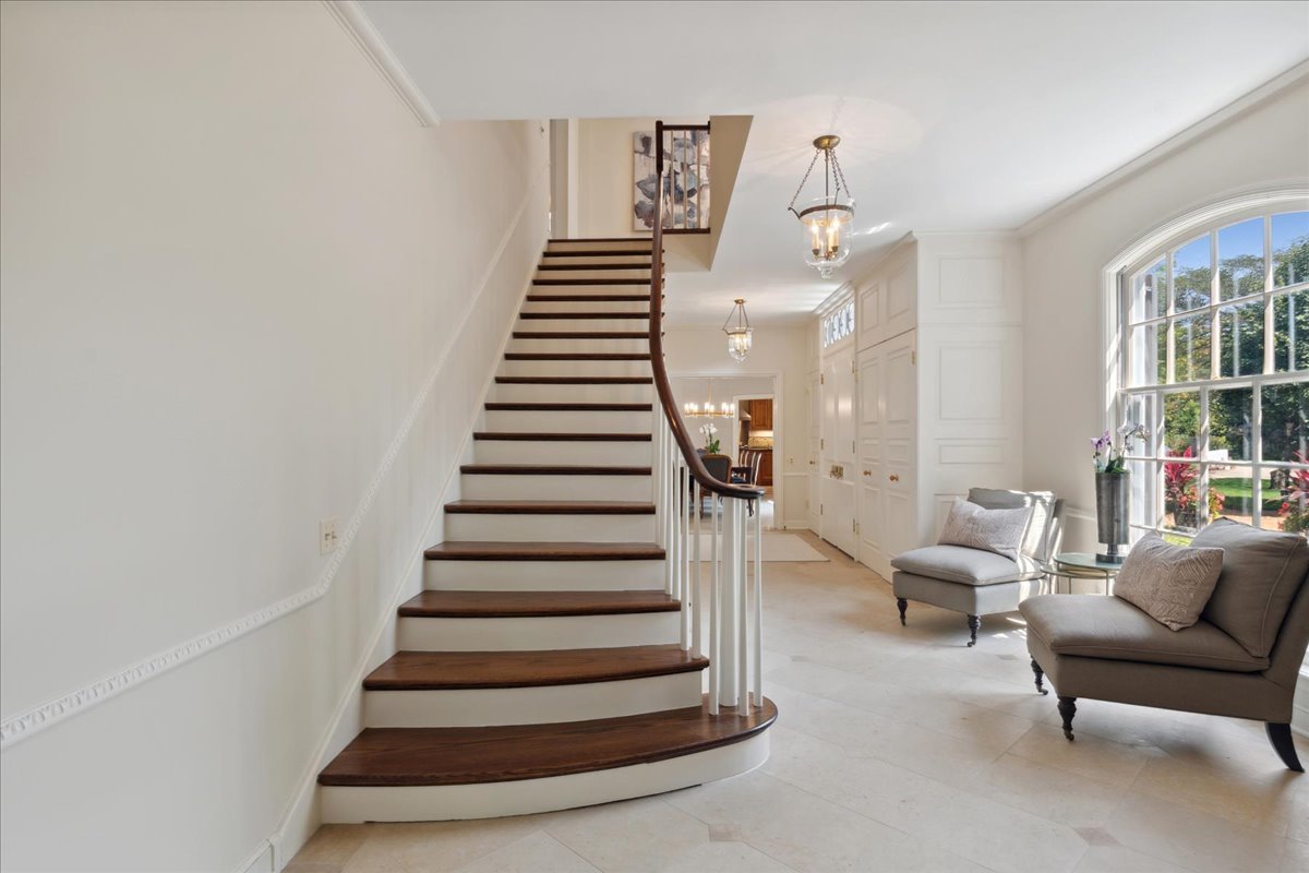 999 Hill Road Winnetka, IL 60093 - Photo 14 of 52 a living room with furniture and stairs