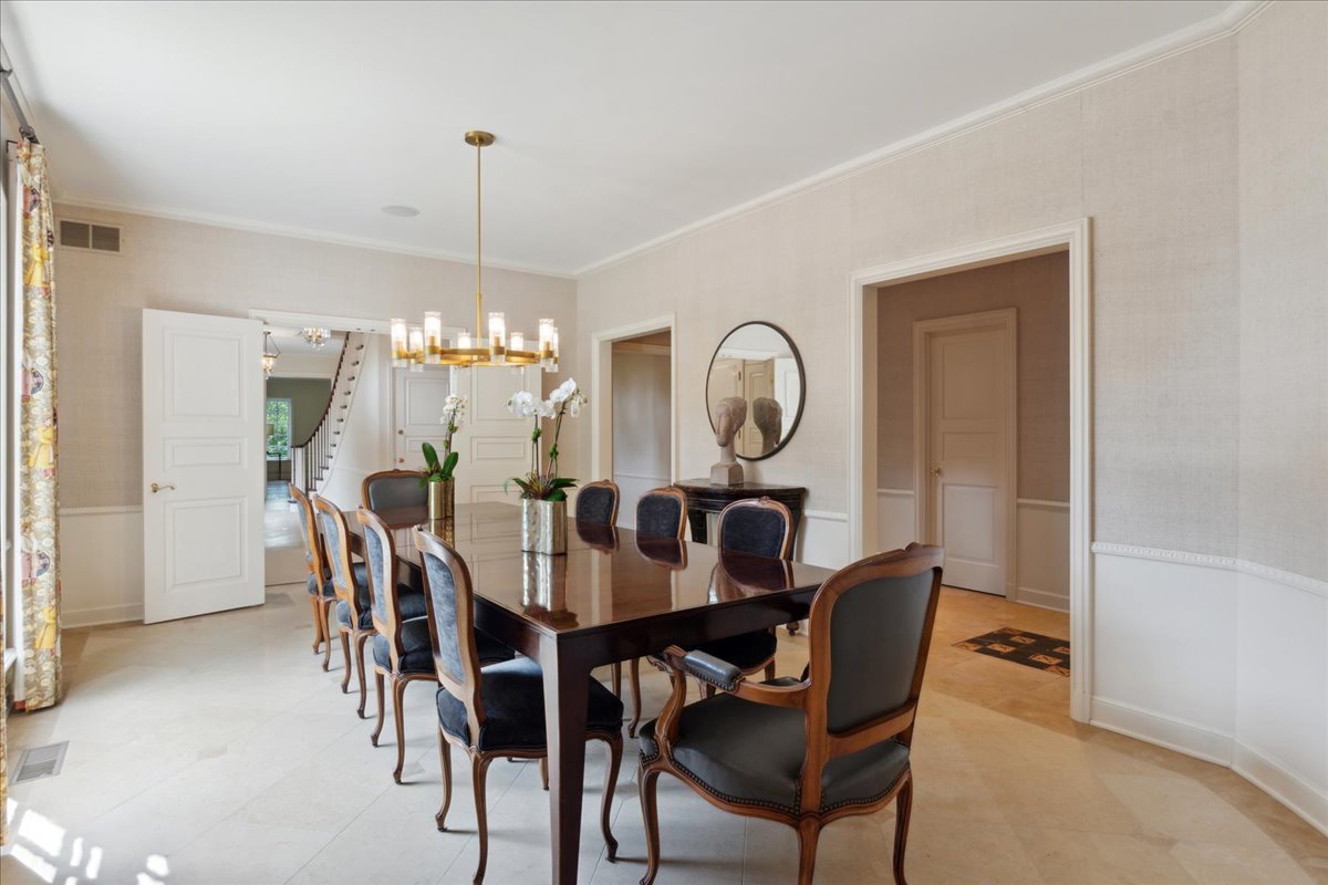 999 Hill Road Winnetka, IL 60093 - Photo 16 of 52 a dining room with furniture a chandelier and wooden floor