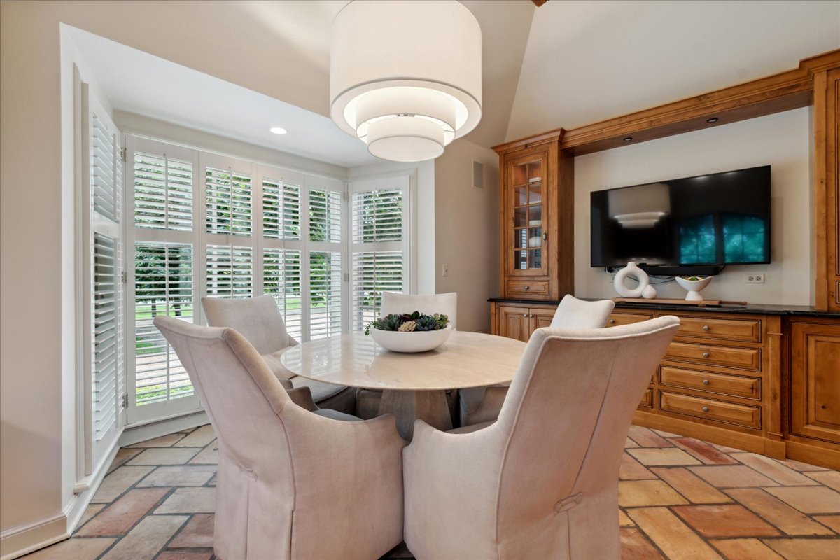 999 Hill Road Winnetka, IL 60093 - Photo 19 of 52 a view of a dining room with furniture window and outside view