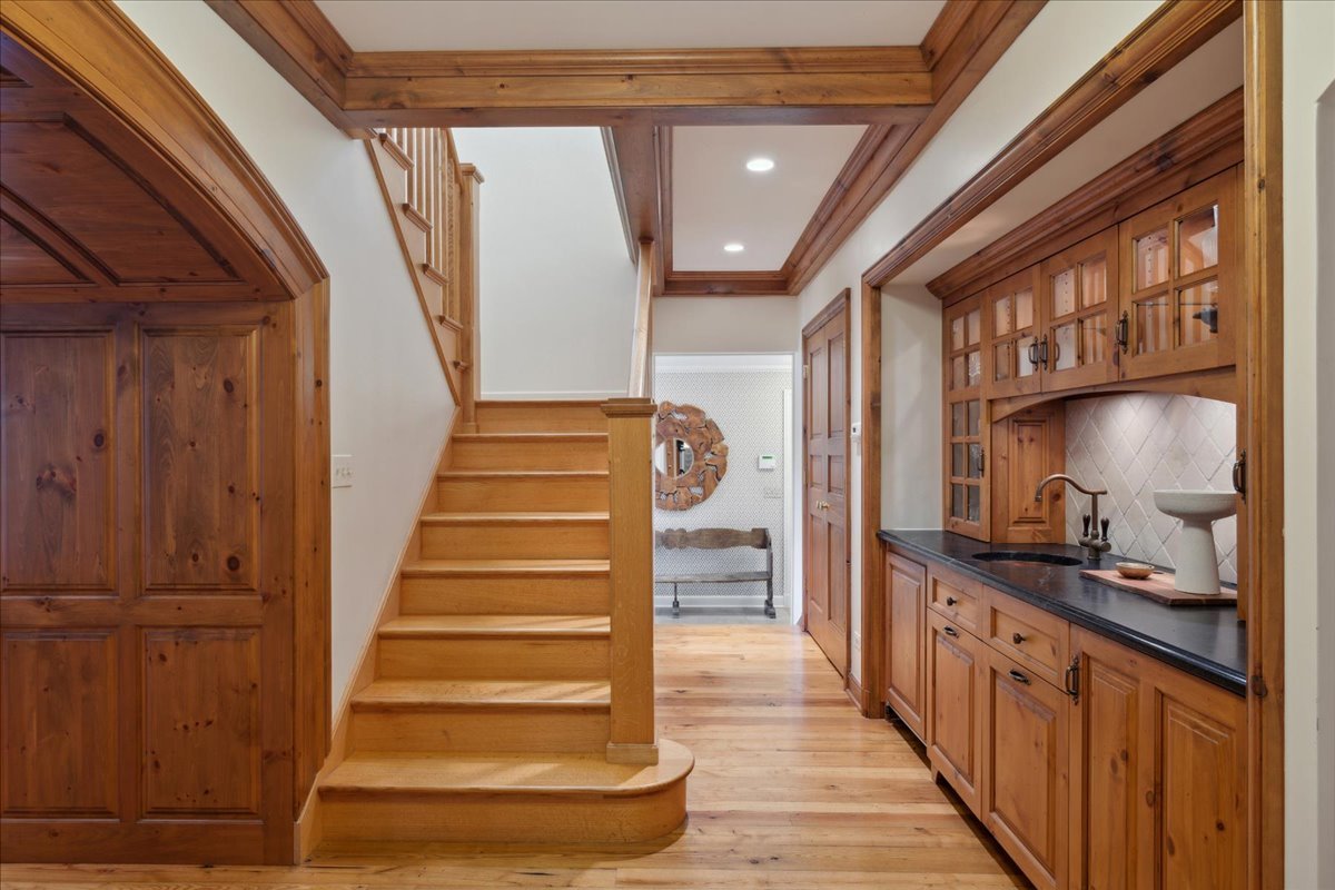 999 Hill Road Winnetka, IL 60093 - Photo 20 of 52 a view of entryway and hall with wooden floor