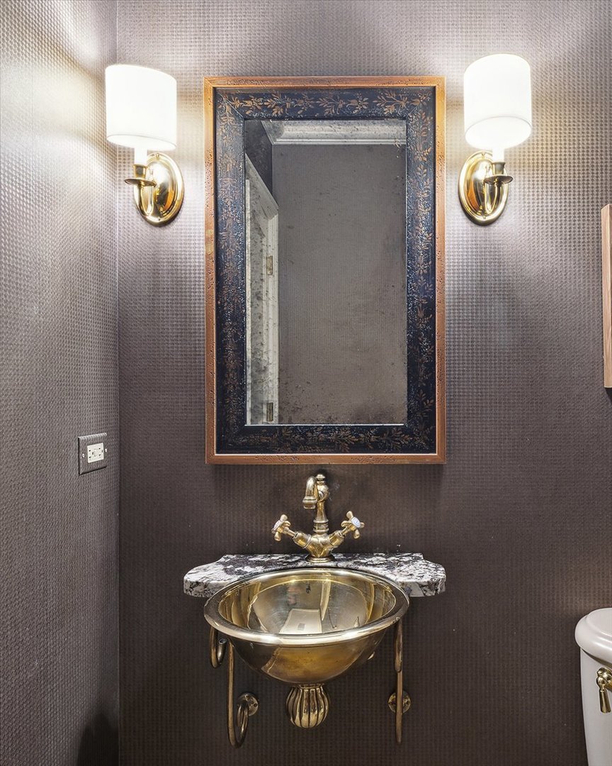 999 Hill Road Winnetka, IL 60093 - Photo 24 of 52 a bathroom with a sink and a mirror