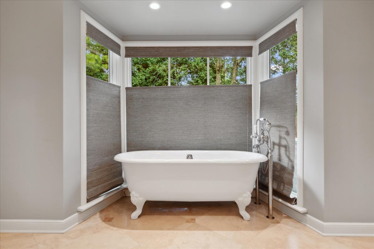 999 Hill Road Winnetka, IL 60093 - Photo 29 of 52 a bath tub sitting in a bathroom next to a window