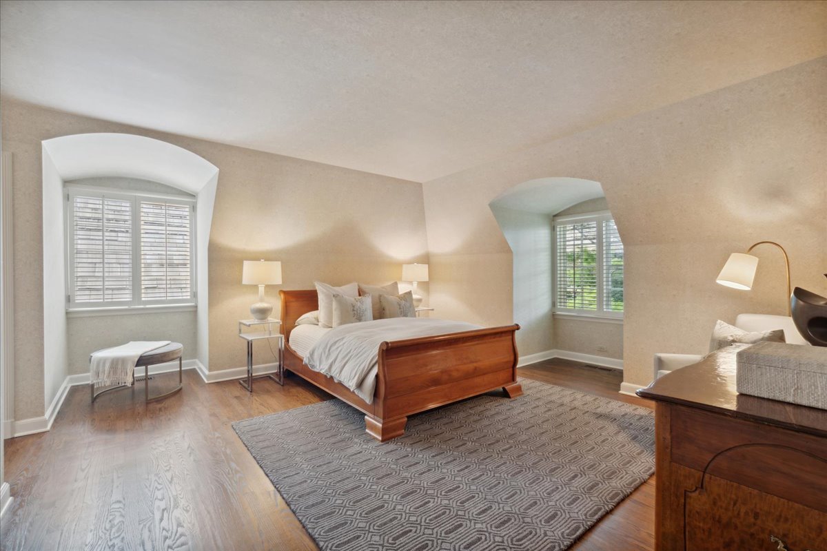 999 Hill Road Winnetka, IL 60093 - Photo 35 of 52 a bedroom with a bed and window