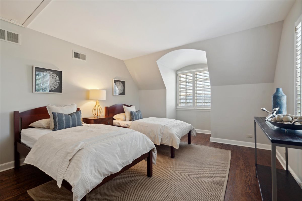 999 Hill Road Winnetka, IL 60093 - Photo 36 of 52 a bedroom with two beds and a window