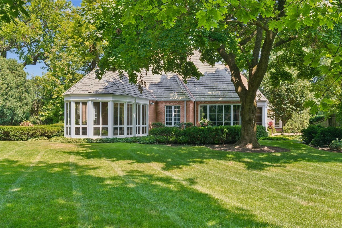 999 Hill Road Winnetka, IL 60093 - Photo 42 of 52 a front view of a house with a yard