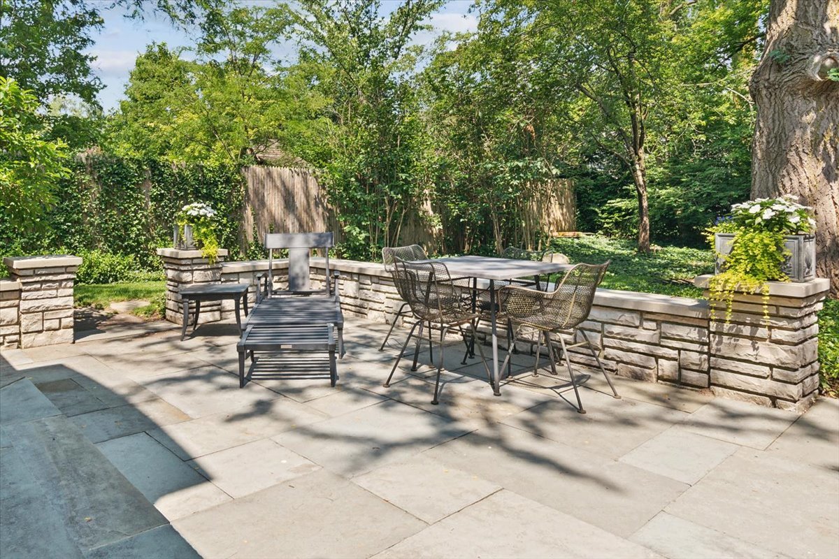 999 Hill Road Winnetka, IL 60093 - Photo 46 of 52 a view of a tables and chairs in a patio