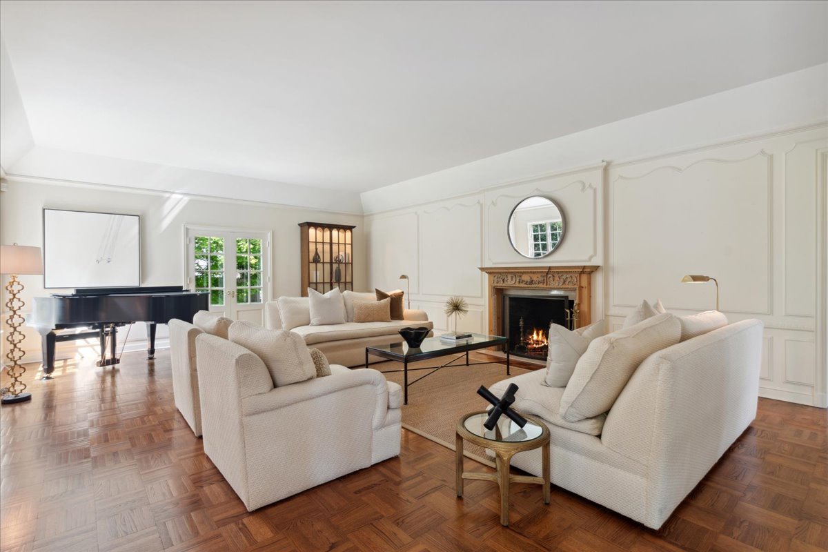 999 Hill Road Winnetka, IL 60093 - Photo 6 of 52 a living room with furniture a fireplace and a table