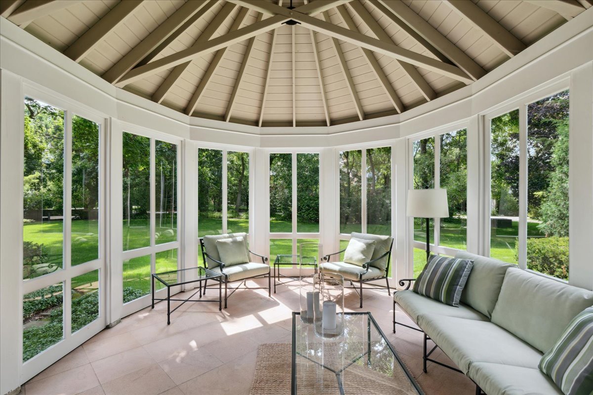 999 Hill Road Winnetka, IL 60093 - Photo 9 of 52 a living room with furniture and a large window