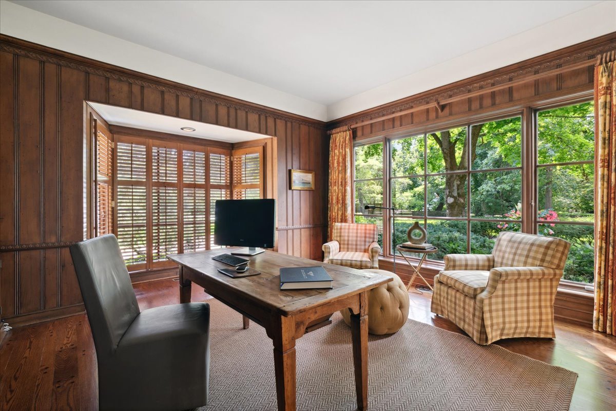 999 Hill Road Winnetka, IL 60093 - Photo 10 of 52 a living room with furniture and a floor to ceiling window