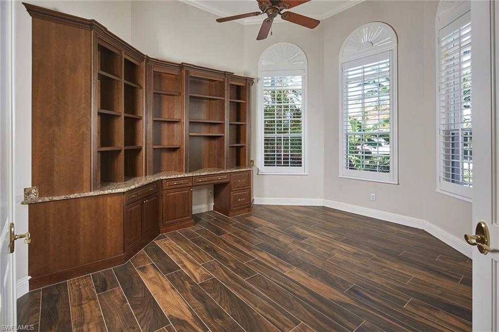 5669 Sago Court Naples, FL 34119 - Photo 16 of 41 Den or office with built in desk, tiled floors, a ceiling fan, and crown molding