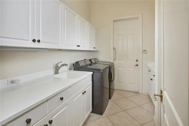 a view of a storage and utility room with a sink