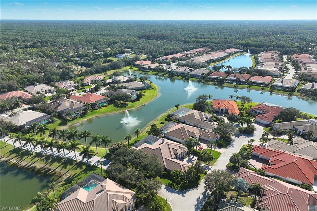 5669 Sago Court Naples, FL 34119 - Photo 32 of 41 Aerial perspective of suburban area with a nearby body of water