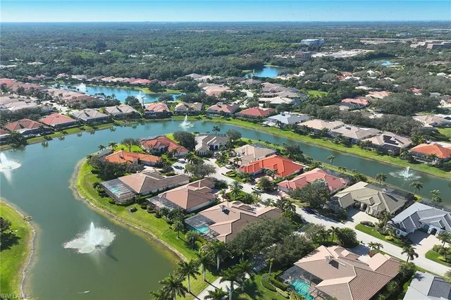 an aerial view of lake residential houses with outdoor space and lake view