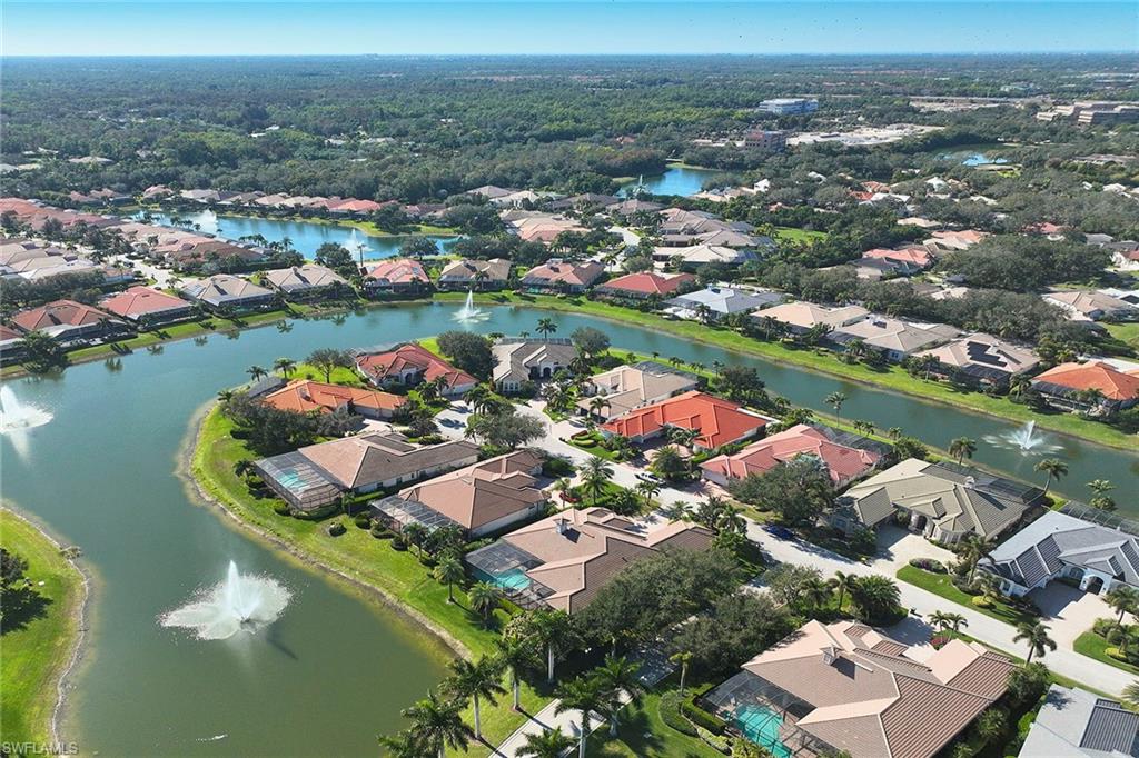 5669 Sago Court Naples, FL 34119 - Photo 33 of 41 Aerial view of property's location featuring a large body of water and nearby suburban area