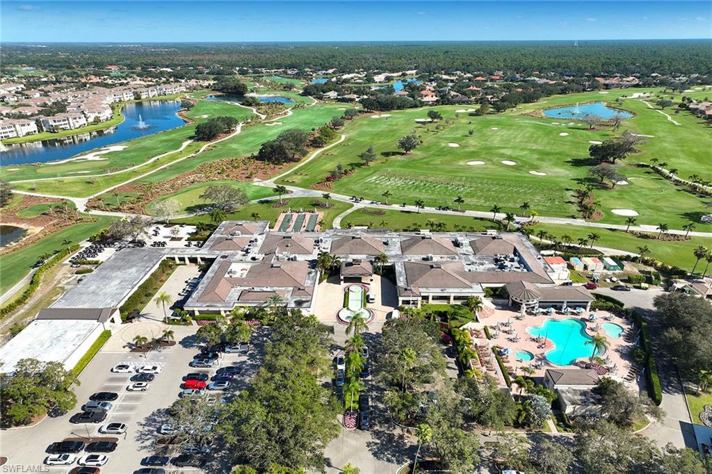 5669 Sago Court Naples, FL 34119 - Photo 36 of 41 Aerial view of property's location with a golf course, a large body of water, and nearby suburban area