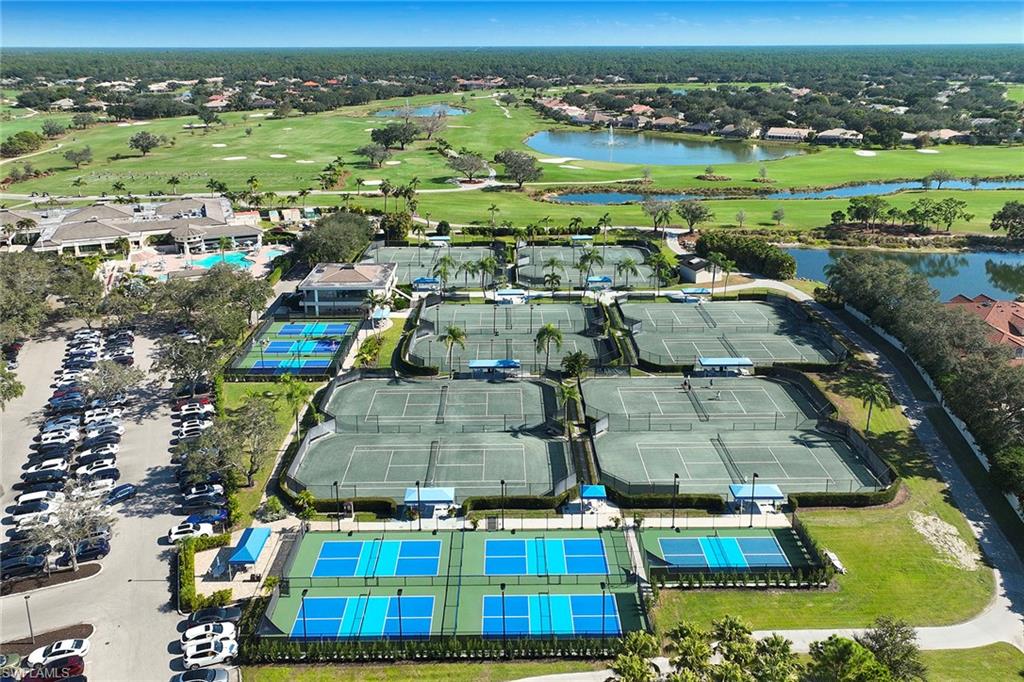 5669 Sago Court Naples, FL 34119 - Photo 38 of 41 Aerial view of property's location featuring a nearby body of water, a golf club, and tennis courts