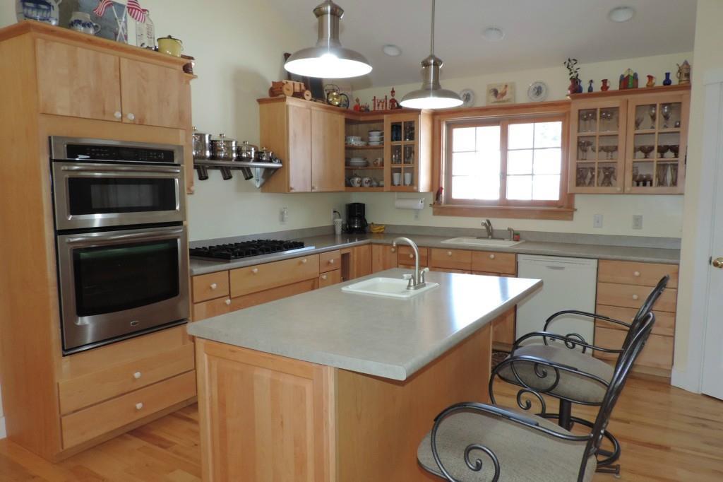 31 Bangs Shore Road Orrs Island, ME 04066 - Photo 8 of 35 Rich Maple cabinets contribute to...