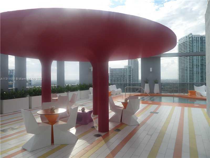 Brickell Miami, FL 33131 - Photo 8 of 14 a swimming pool with outdoor seating and yard