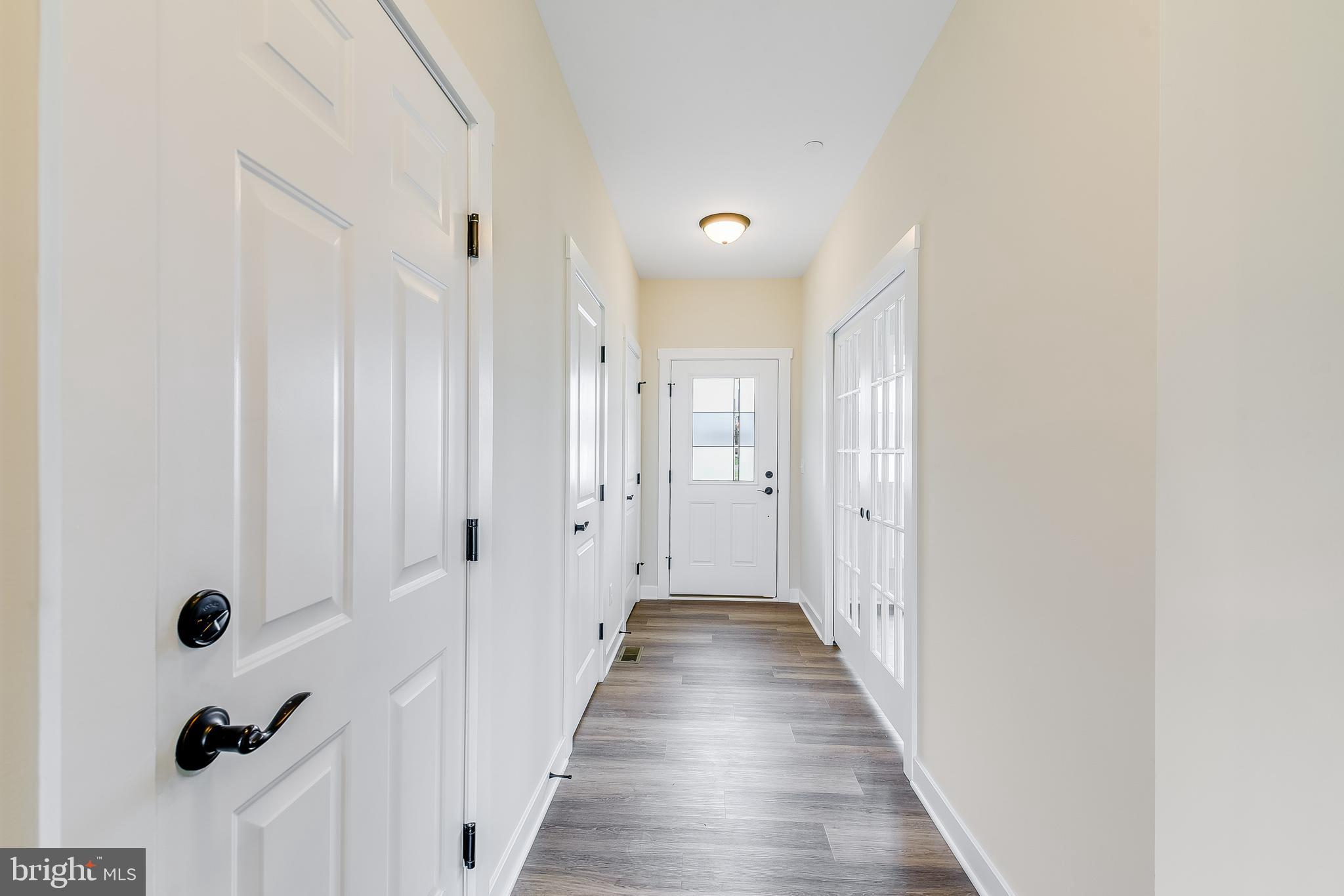 503 South Farm Crossing Road Severn, MD 21144 - Photo 11 of 46 a view of a hallway with wooden floor