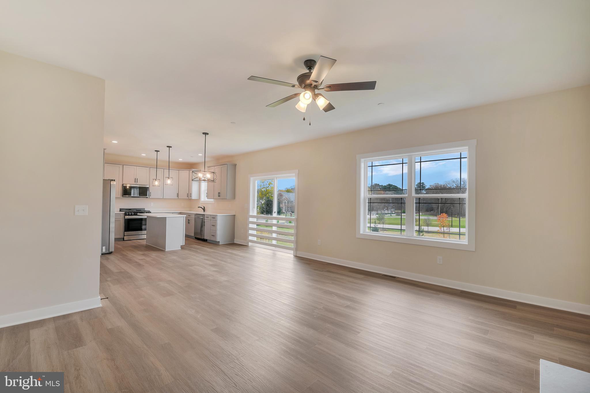 503 South Farm Crossing Road Severn, MD 21144 - Photo 18 of 46 a view of a livingroom with furniture a ceiling fan and wooden floor