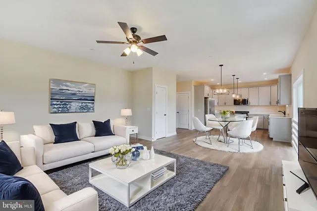 an aerial view of residential houses with outdoor space and swimming pool