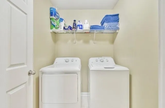 a utility room with dryer and washer
