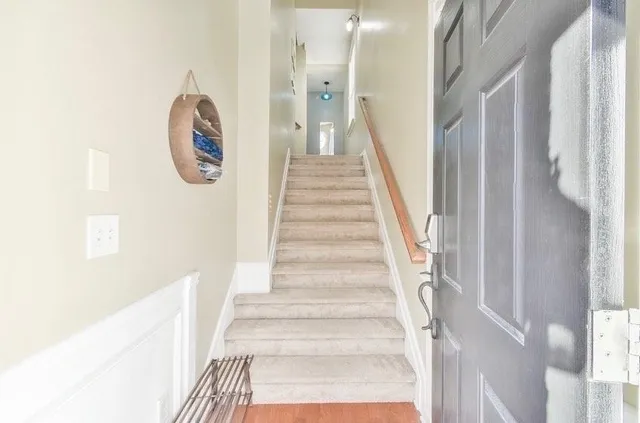 a view of a hallway with staircase