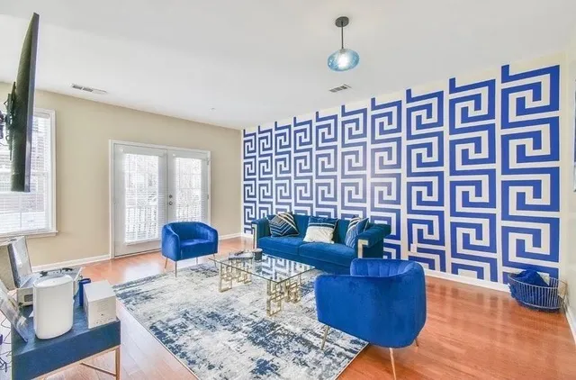 a living room with furniture rug and window
