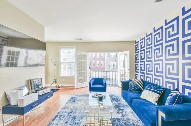 a living room with furniture and a large window