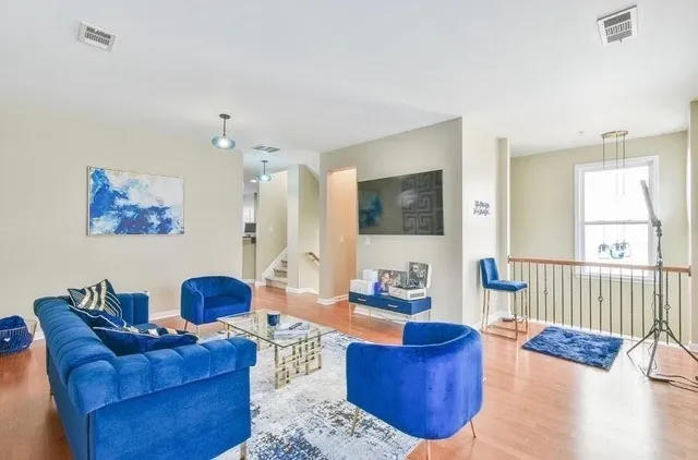 a living room with furniture or couch and a flat screen tv