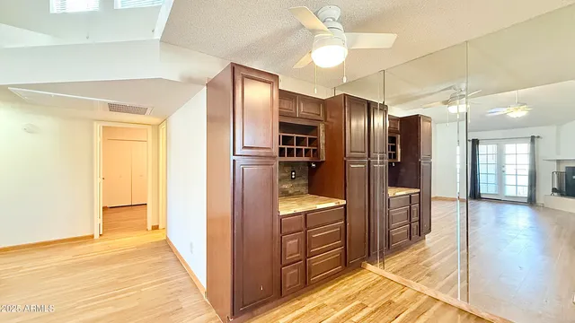 a kitchen with stainless steel appliances kitchen island granite countertop a refrigerator and a sink