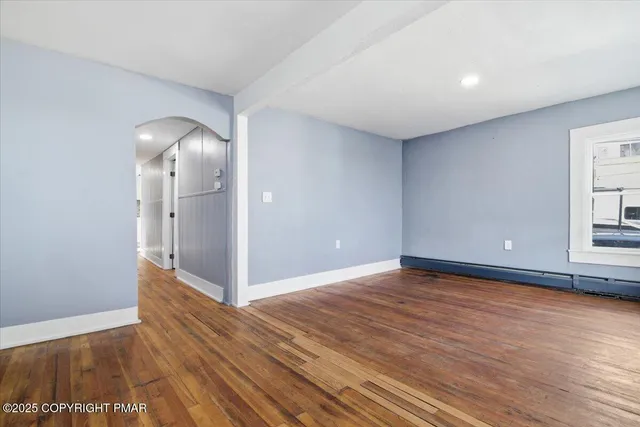 a kitchen with stainless steel appliances granite countertop a stove a microwave and a refrigerator