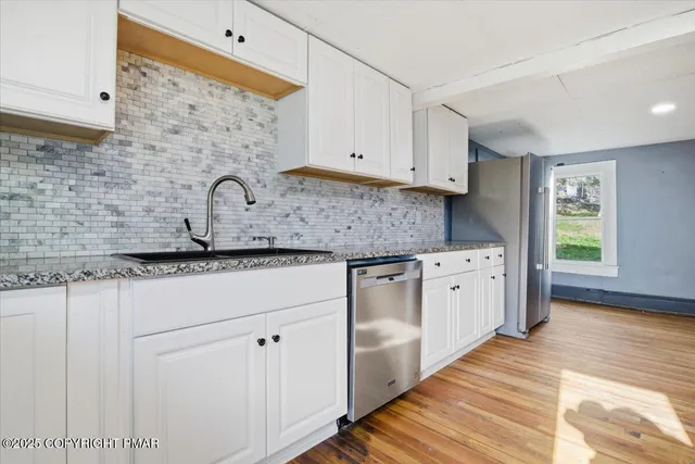a view of entryway with wooden floor