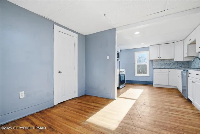 a view of a bathroom with wooden floor