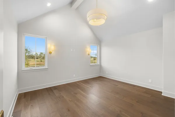 a bedroom with furniture and white walls