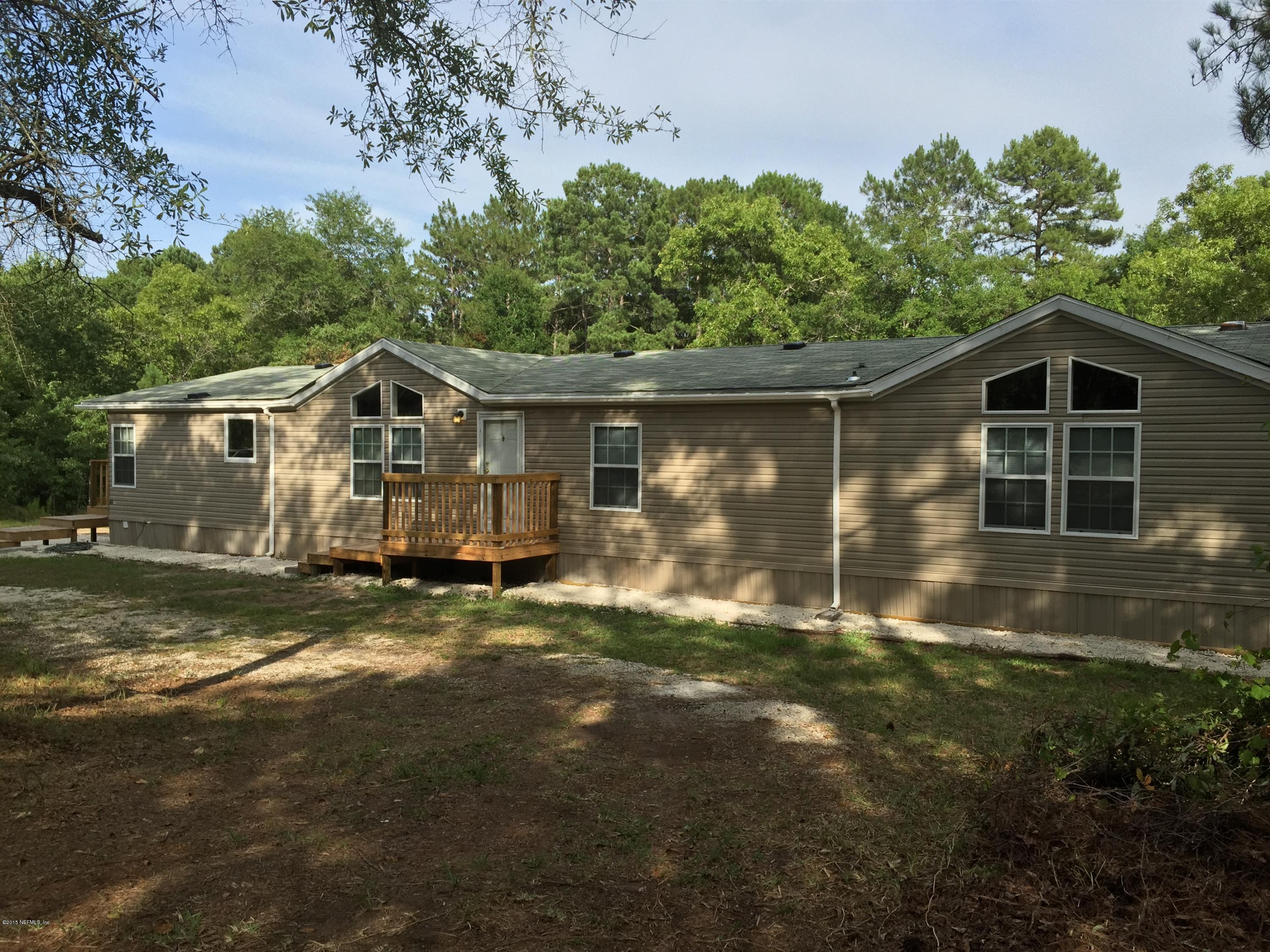4653 Calendula Avenue Middleburg, FL 32068 - Photo 11 of 50 a view of a house with backyard and garden