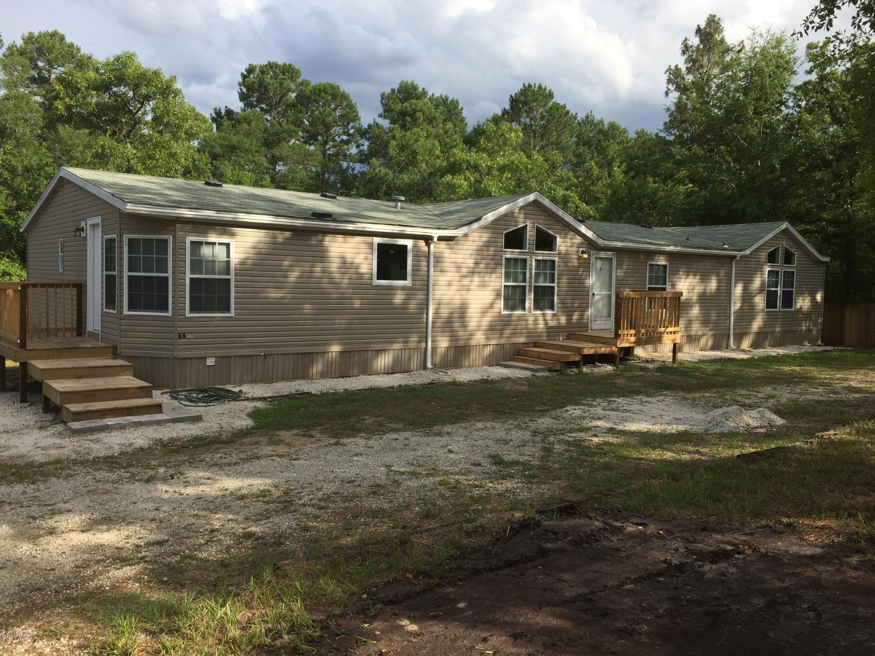 4653 Calendula Avenue Middleburg, FL 32068 - Photo 12 of 50 a view of a house with a yard
