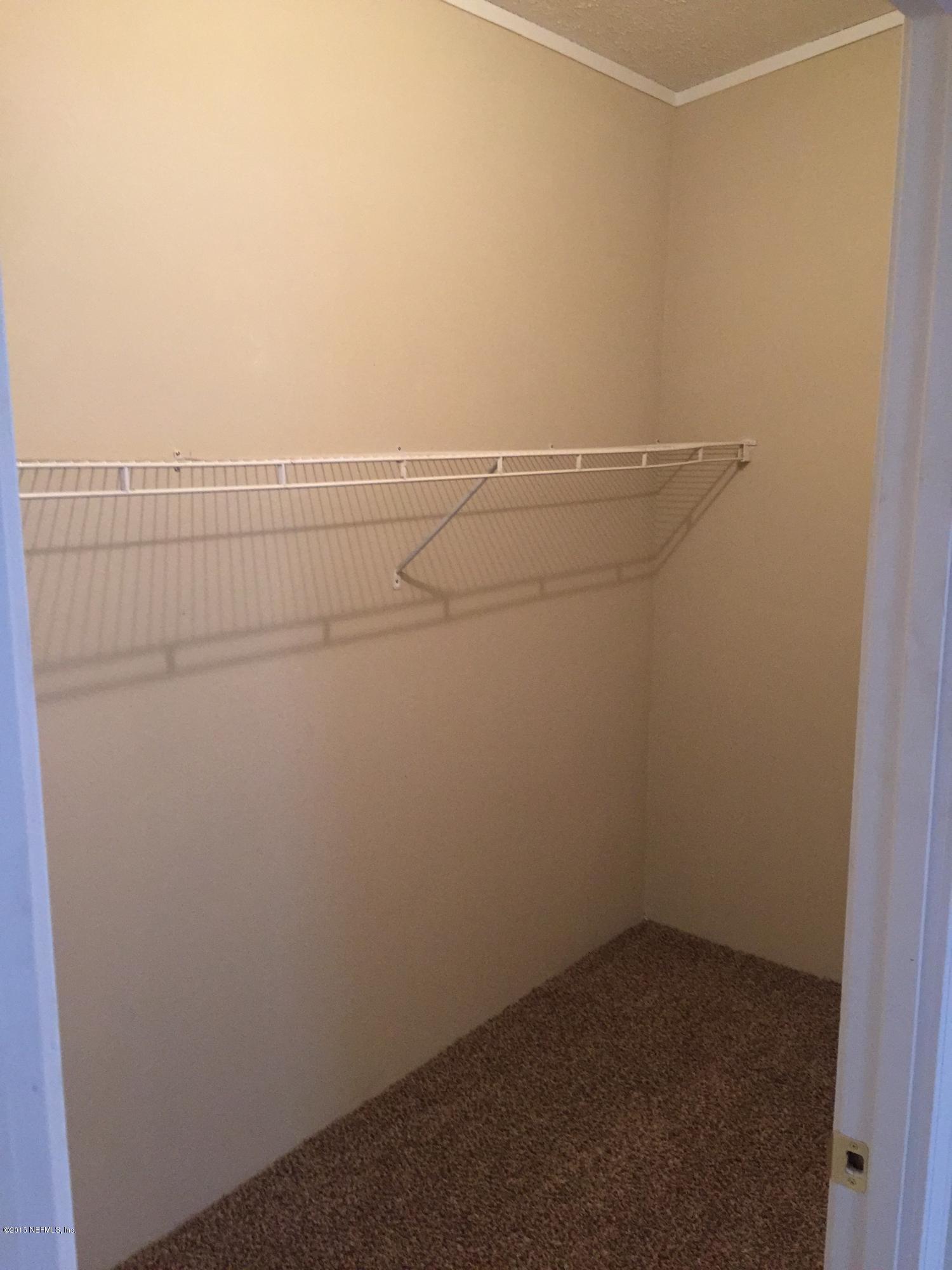4653 Calendula Avenue Middleburg, FL 32068 - Photo 17 of 50 a view of a room with racks on the wall
