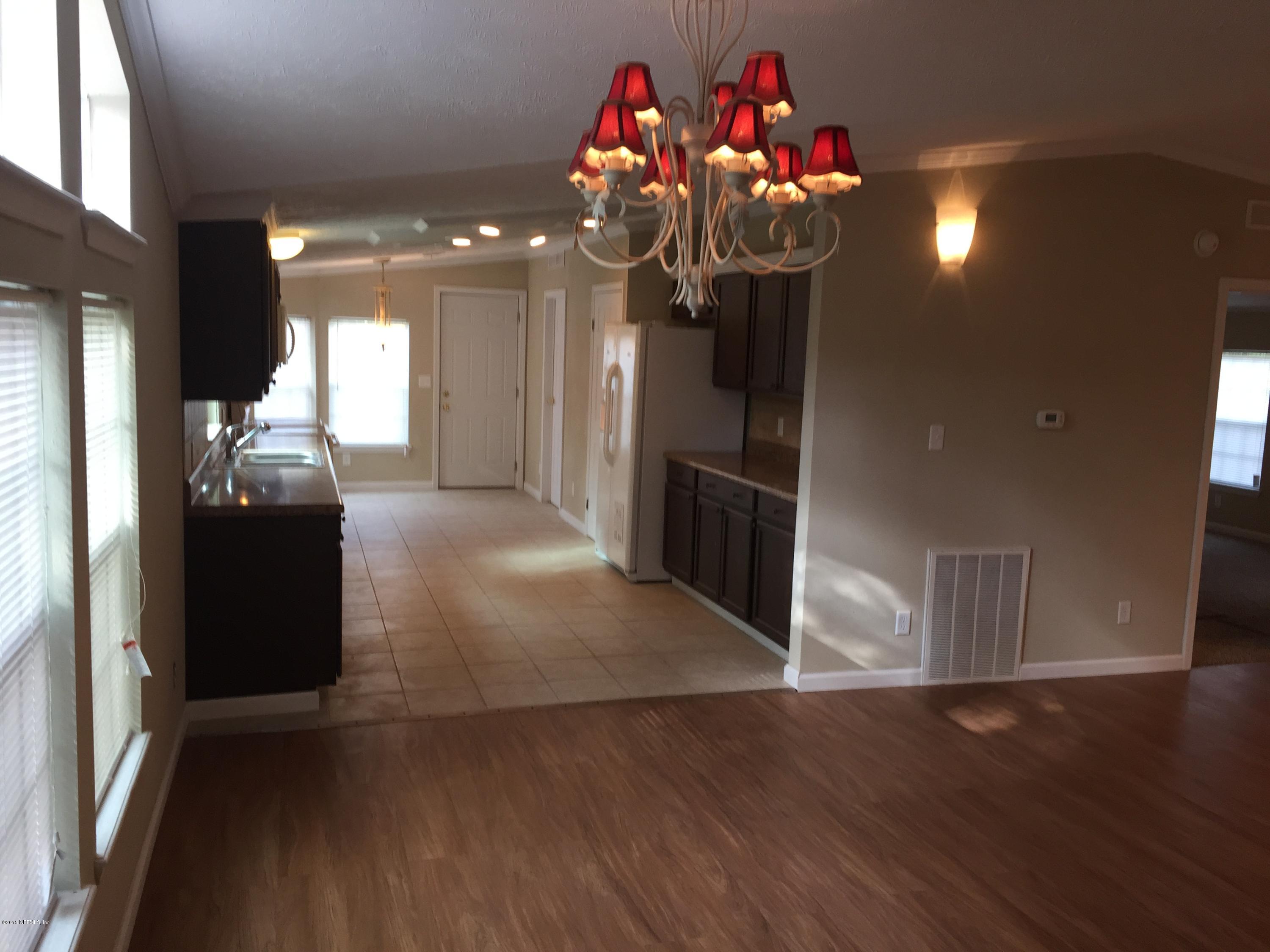 4653 Calendula Avenue Middleburg, FL 32068 - Photo 24 of 50 a view of a livingroom with wooden floor