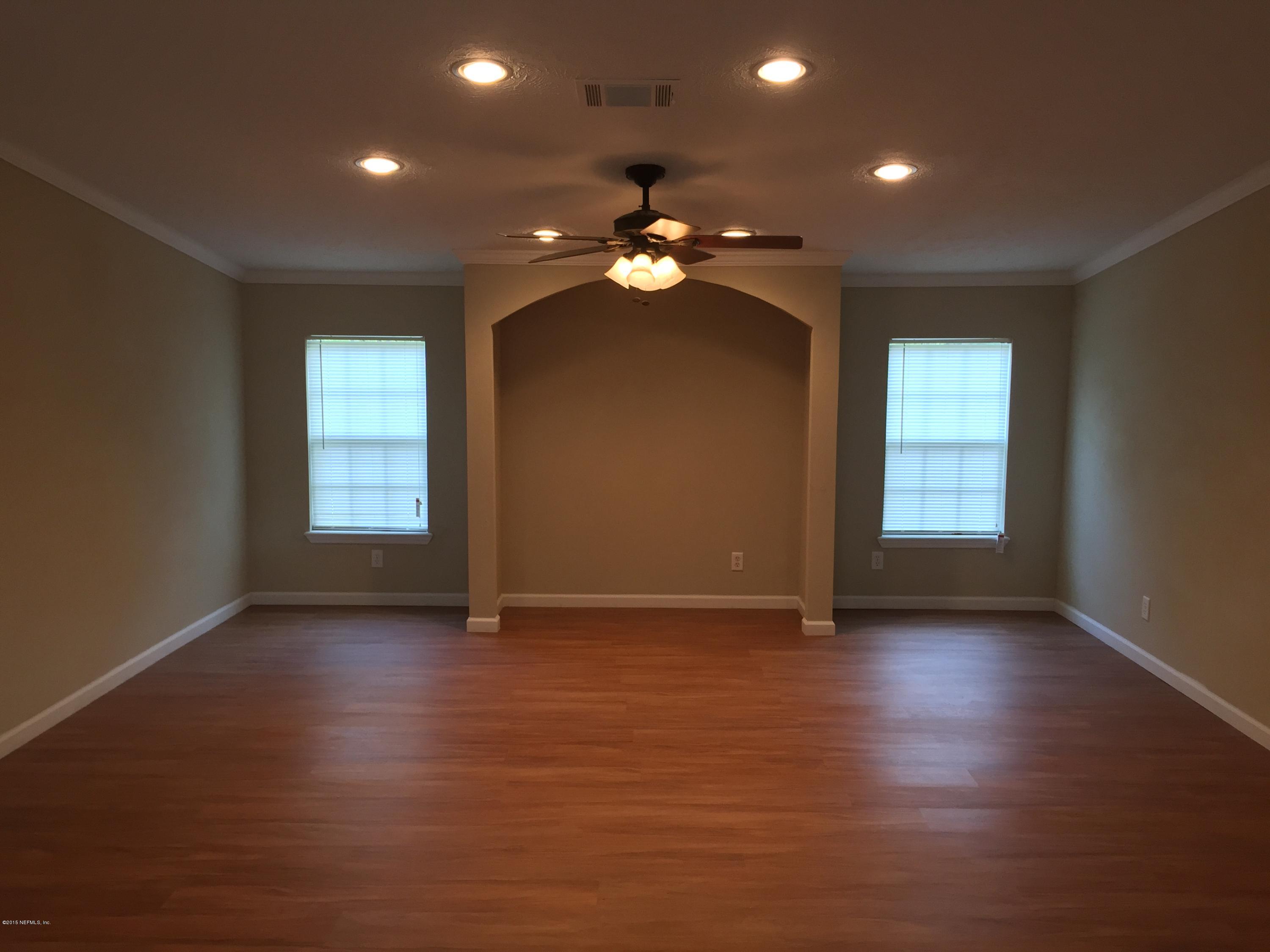 4653 Calendula Avenue Middleburg, FL 32068 - Photo 27 of 50 wooden floor in an empty room with a window